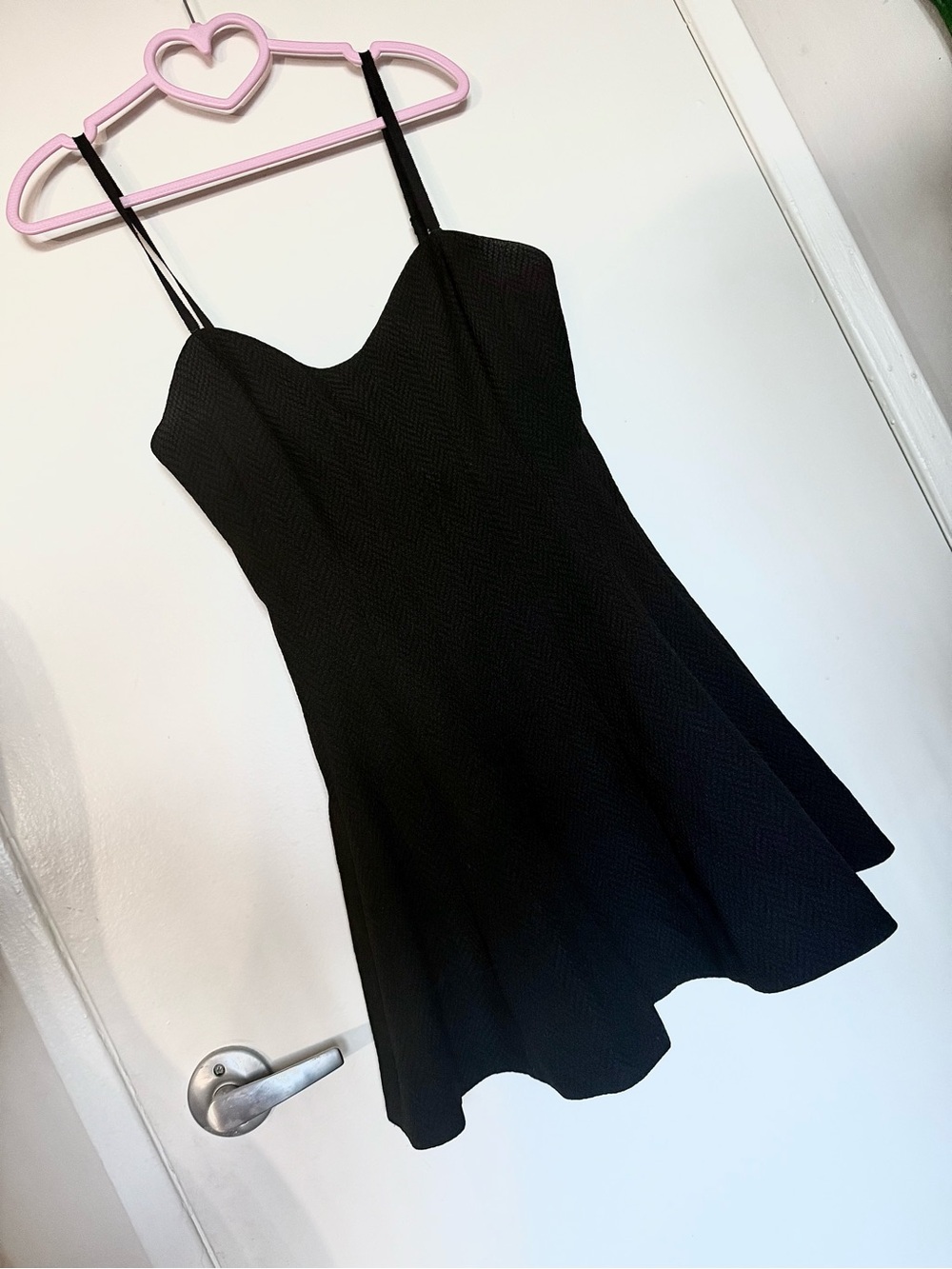Black skater dress with textured fabric